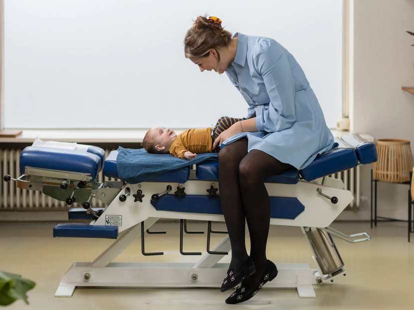 Chiropractor with child